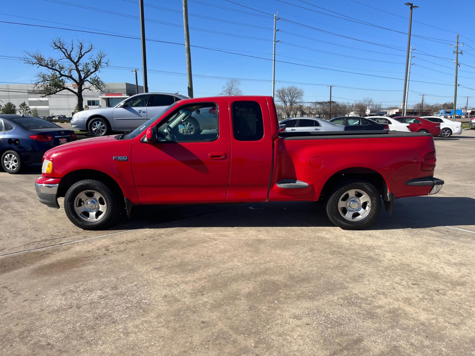 2003 red /TAN Ford F-150 XL SuperCab Flareside 2WD (1FTRX07213K) with an 4.2L V6 OHV 12V engine, Automatic transmission, located at 14700 Tomball Parkway 249, Houston, TX, 77086, (281) 444-2200, 29.928619, -95.504074 - Photo #3
